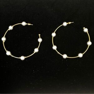 And now this.. gold tone faux pearl large hoop earring
